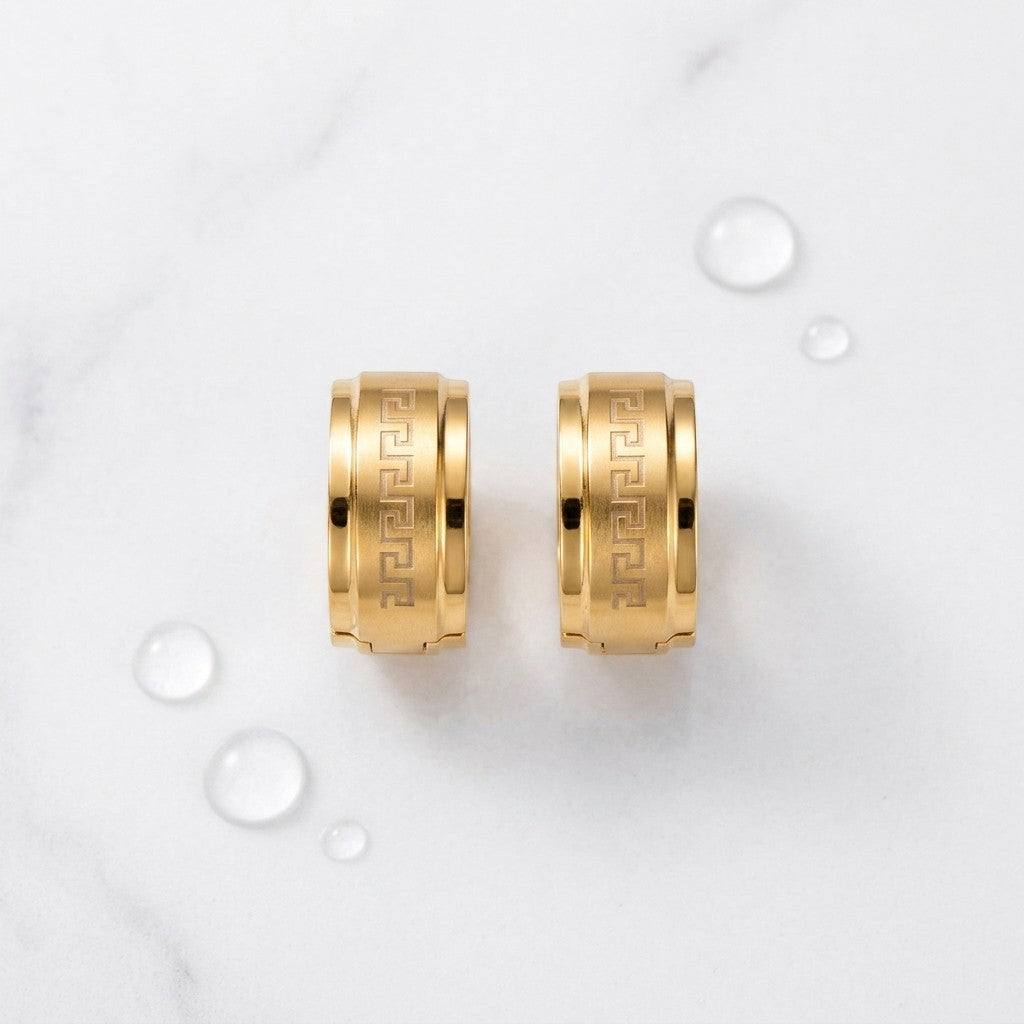 Aramat Jewels gold-tone stainless steel hoop earrings with Greek key pattern, available in 13mm and 20mm.