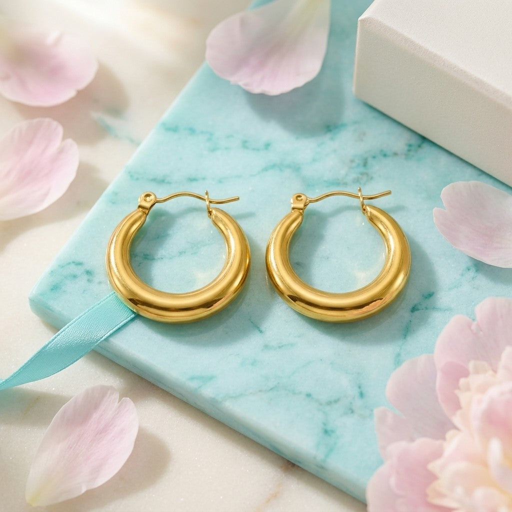 Aramat Jewels gold-tone stainless steel hoop earrings, 20x4mm, smooth polished finish, perfect for everyday wear or stacking.