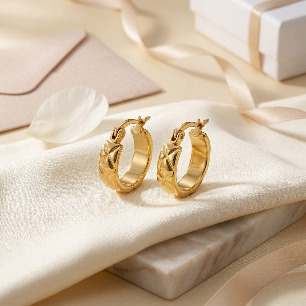 Aramat Jewels gold-tone stainless steel hoop earrings with a diamond pattern, 10mm diameter.