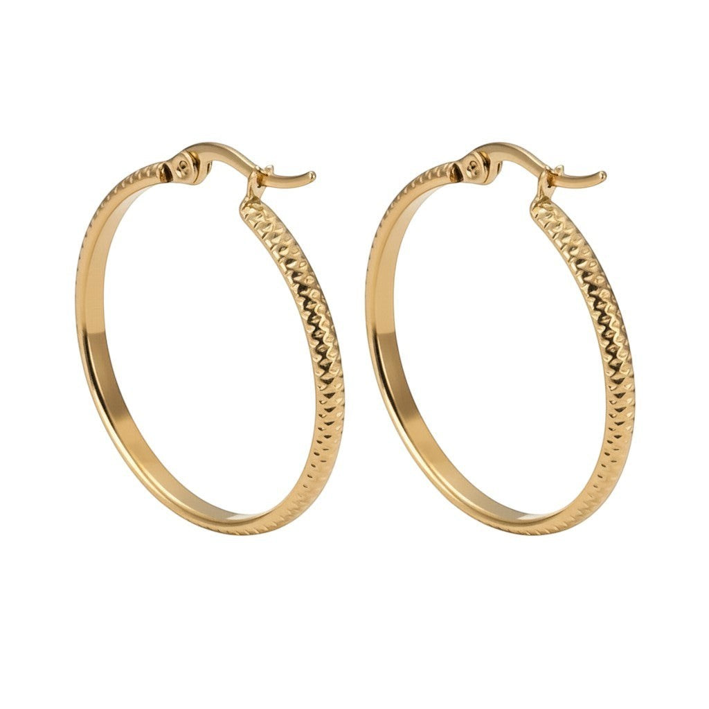 Aramat Jewels gold stainless steel hoop earrings with a textured dot pattern, 25mm diameter.
