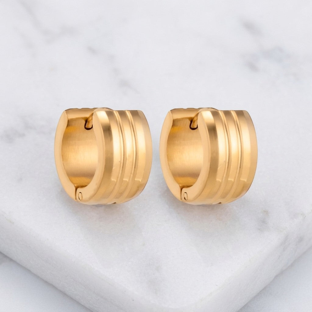 Aramat Jewels gold-tone stainless steel hoop earrings with double stripe detail. Available in 13mm and 20mm.