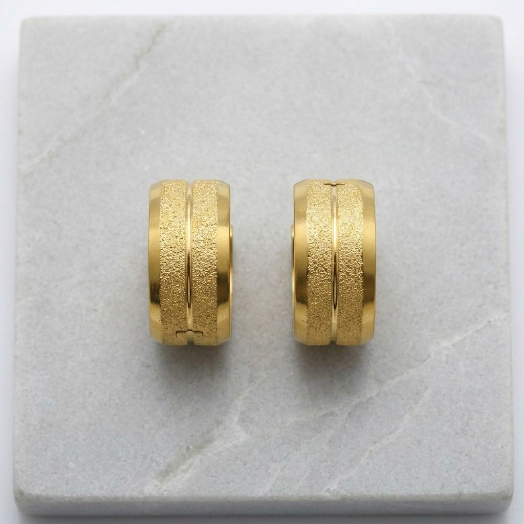 Aramat Jewels gold-tone stainless steel hoop earrings with sandblasted stripes, 13x7mm.