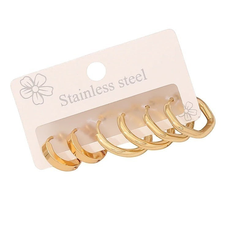 Aramat Jewels gold-colored stainless steel hoop earring set with 2 round and 1 hexagonal pair.