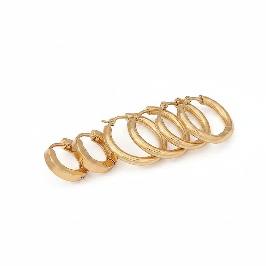 Aramat Jewels gold-colored stainless steel hoop earrings set: 2 round, 1 hexagonal. Click closure.