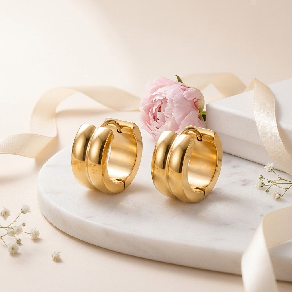 Aramat Jewels gold-colored stainless steel hoop earrings with a single stripe design, 13mm diameter.