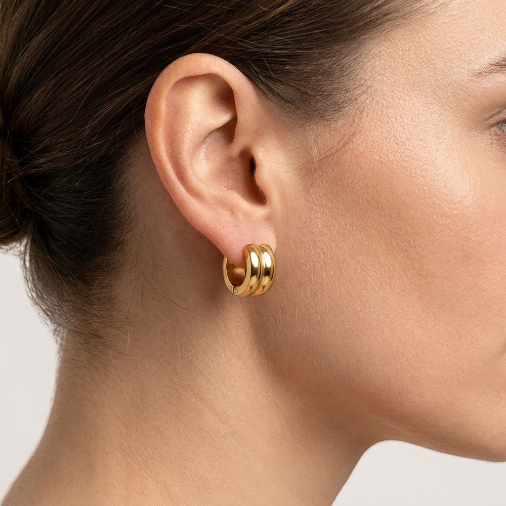 Aramat Jewels gold-tone stainless steel hoop earrings with a single stripe detail, 13mm diameter.