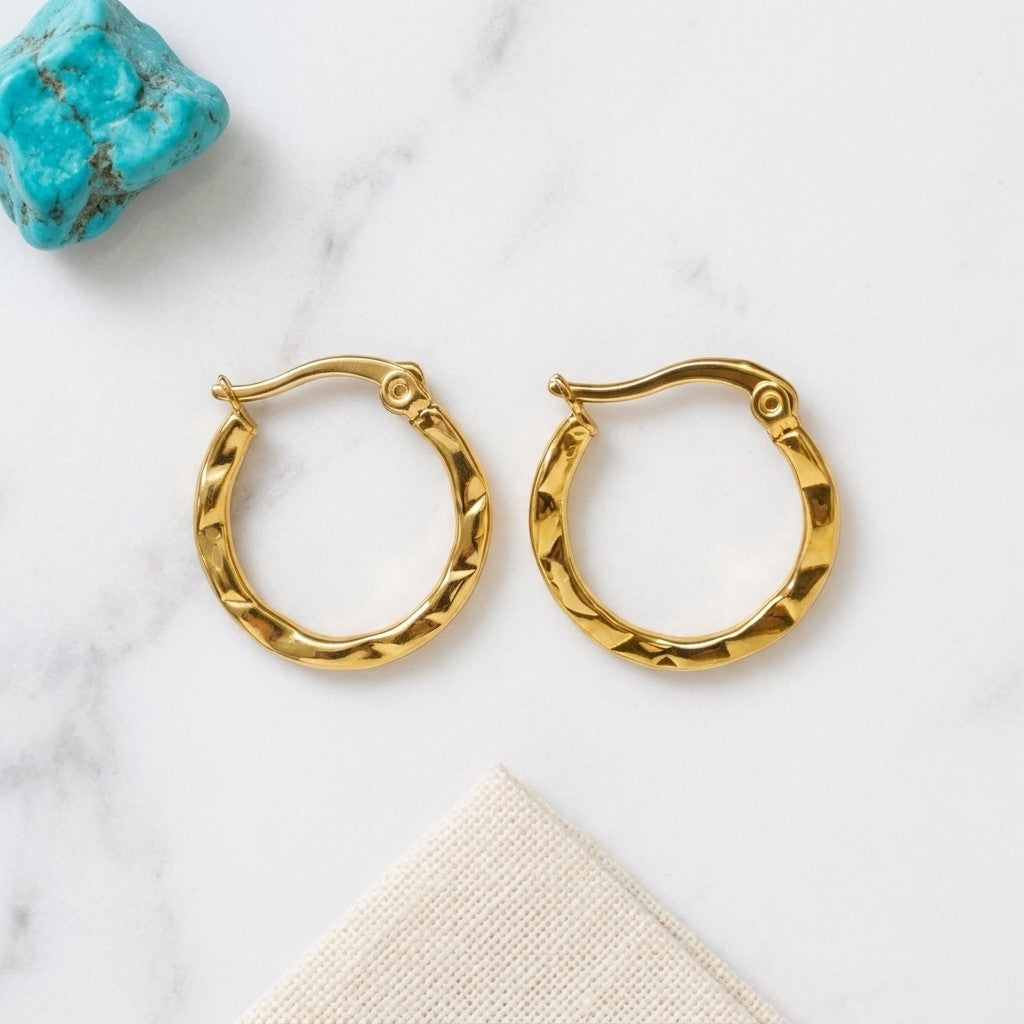 Aramat Jewels gold-tone stainless steel hoop earrings with a fine stripe pattern, 20mm diameter, perfect for everyday or special occasions.