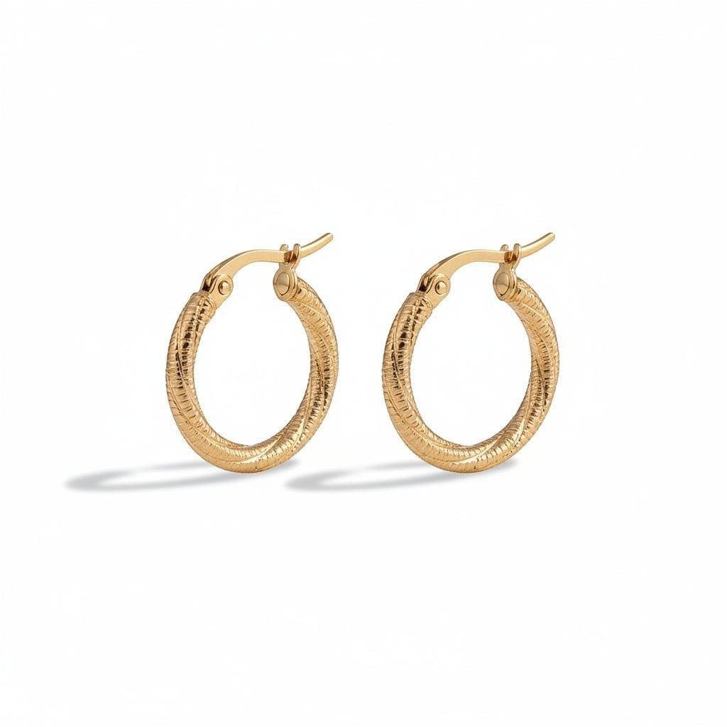 Aramat Jewels gold-tone twisted, diamond-cut stainless steel hoop earrings, 20mm diameter, with hinge clasp.