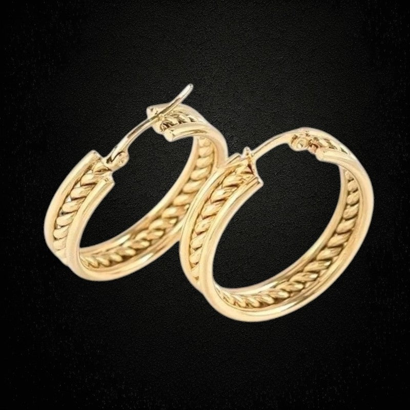 Aramat Jewels gold-tone stainless steel hoop earrings with a twisted rope design detail. Diameter 30mm.