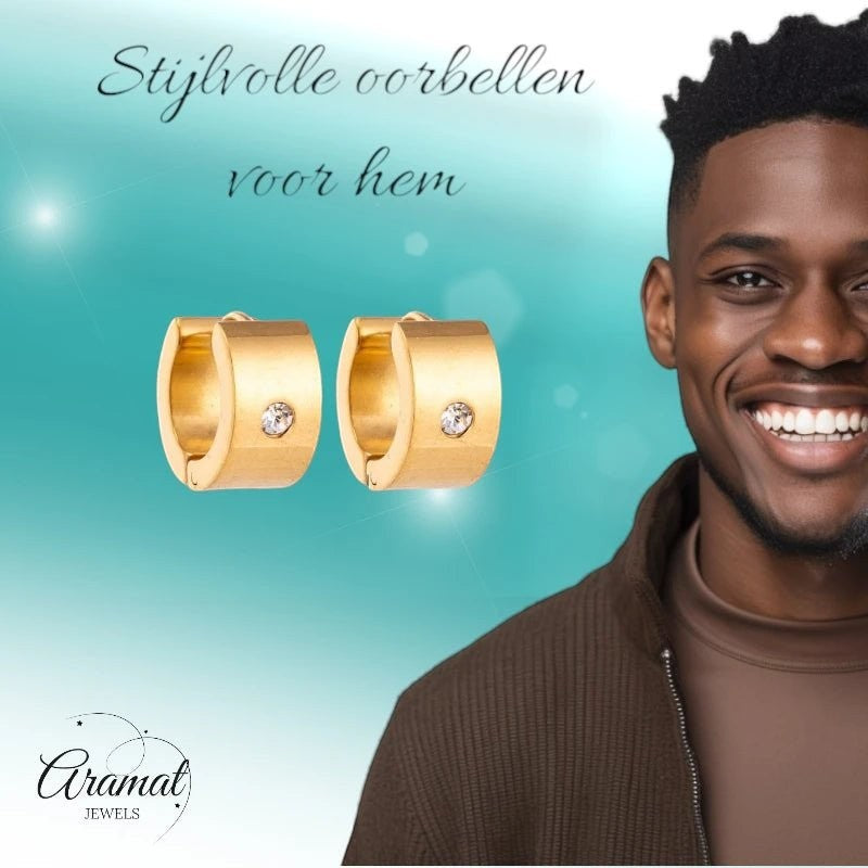 Aramat Jewels gold-colored wide stainless steel hoop earrings with a single clear zirconia stone, unisex design.