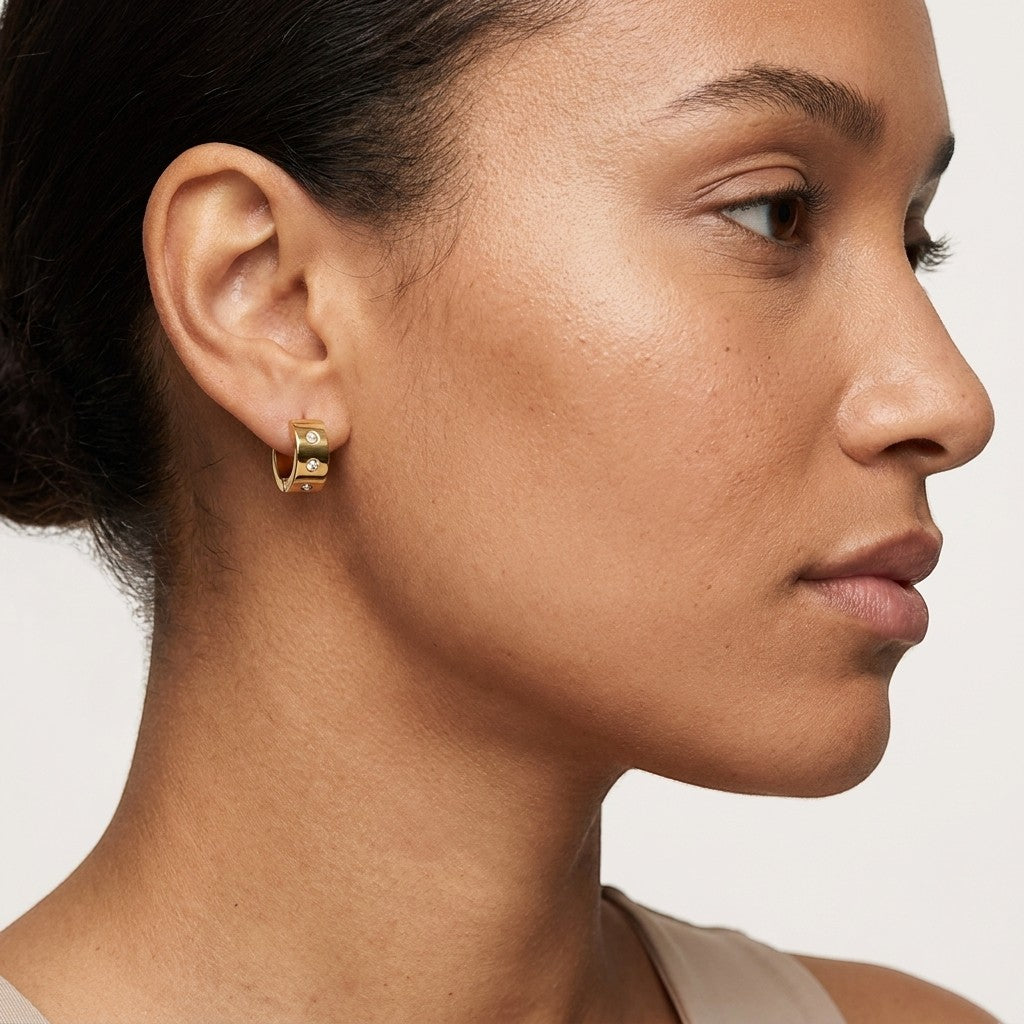 Aramat Jewels gold-tone stainless steel hoop earrings with double zirconia stones, 13mm or 20mm diameter.