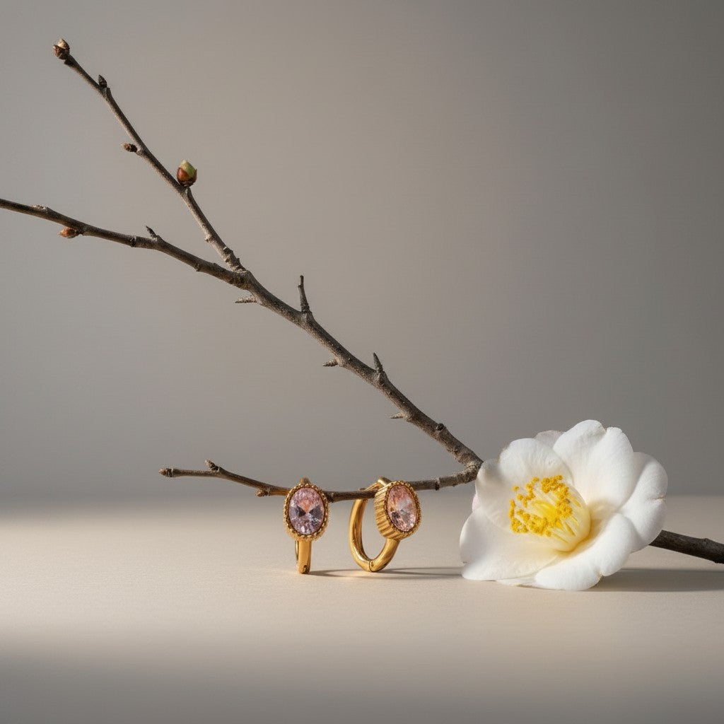 Aramat Jewels gold-plated mini hoop earrings with oval pink zirconia stones, 15mm diameter.