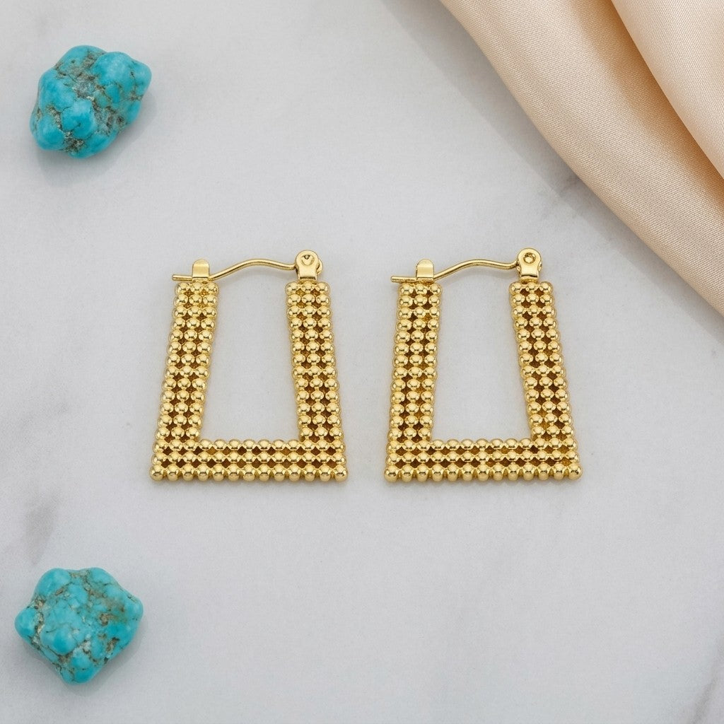 Aramat Jewels gold-tone stainless steel rectangular hoop earrings with a beaded texture, 28x20mm.