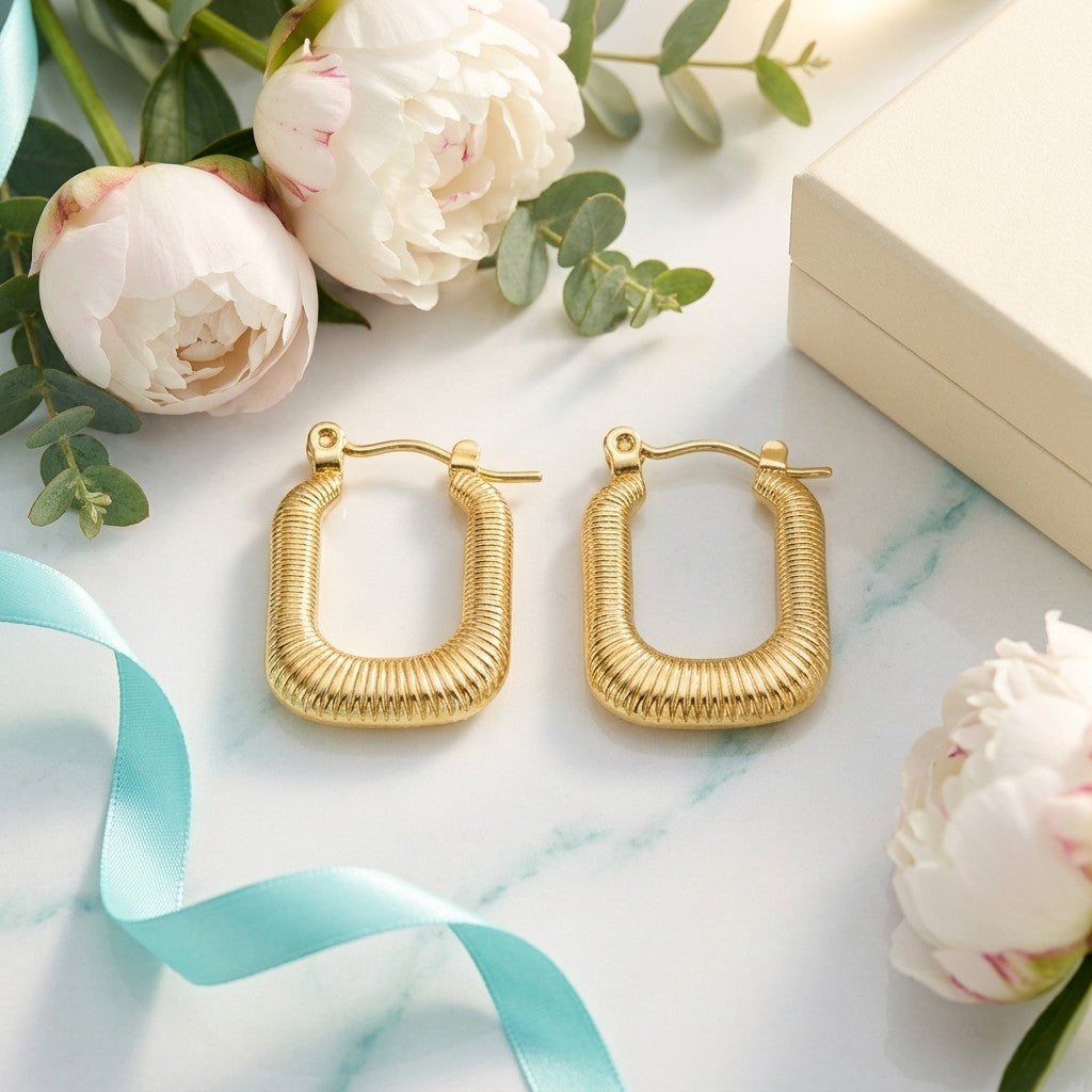 Aramat Jewels gold rectangular ribbed hoop earrings, 30x16mm, made of stainless steel. Elegant and trendy design.