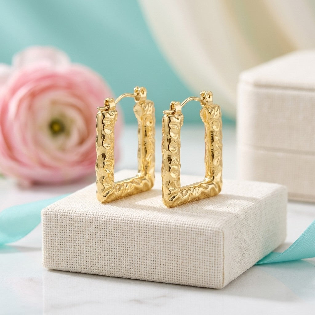 Aramat Jewels gold rectangular hoop earrings with a textured stripe pattern, 26x18mm, featuring a hinge closure.