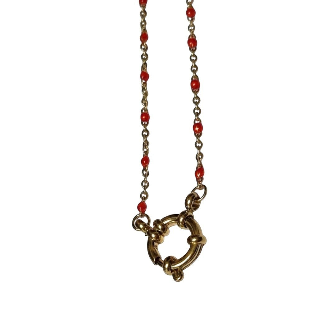 Aramat Jewels gold-tone chain necklace with small red enamel beads and a large circular clasp.