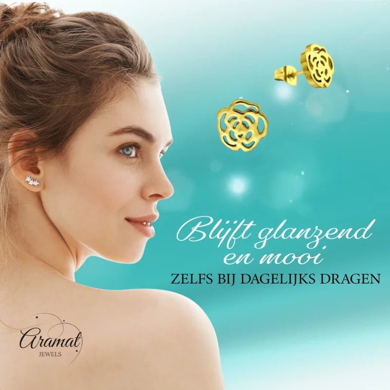 Aramat Jewels gold-tone stainless steel rose stud earrings with an open-cut design worn by a woman.
