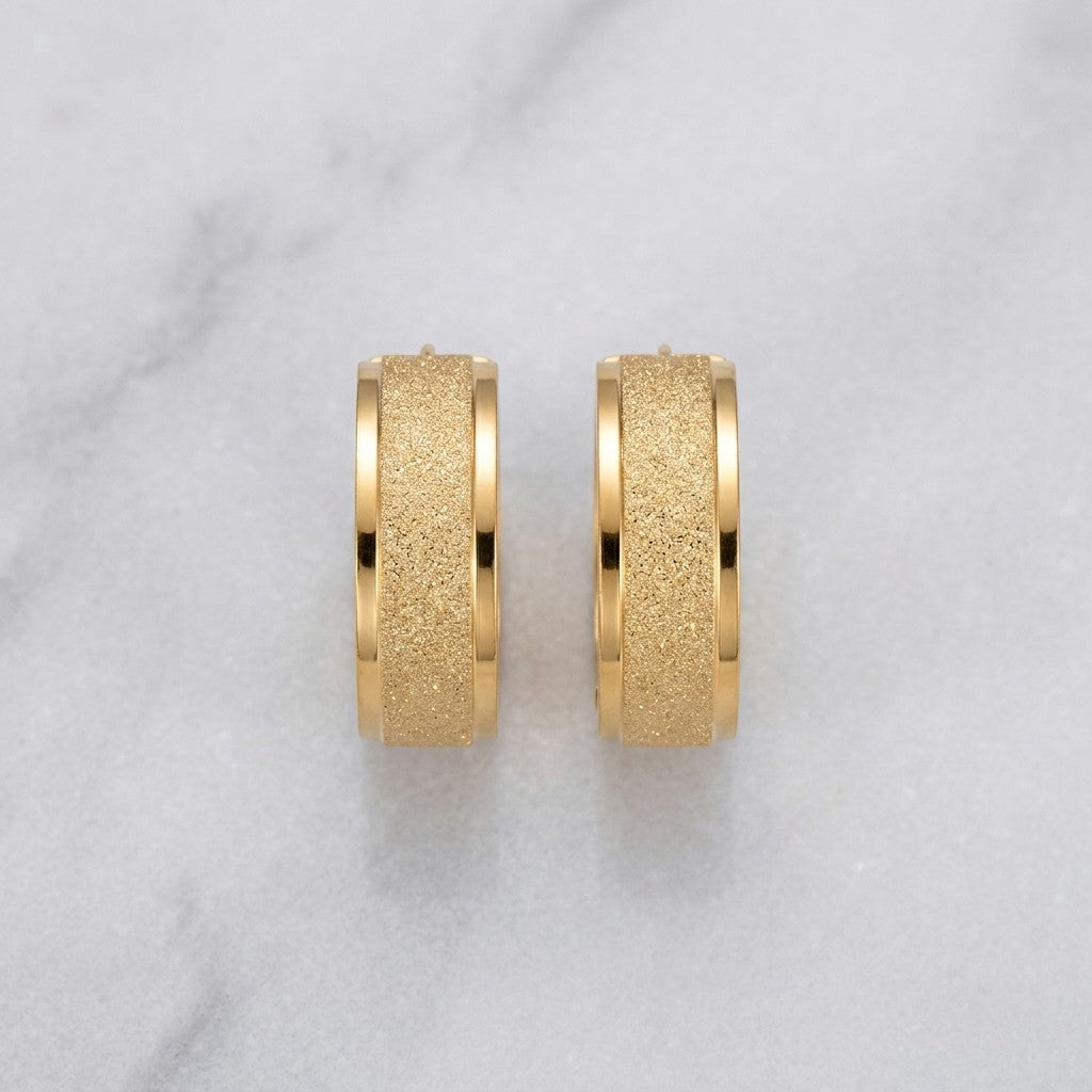 Aramat Jewels gold-tone stainless steel hoop earrings with sandblasted texture, 13mm or 20mm diameter.