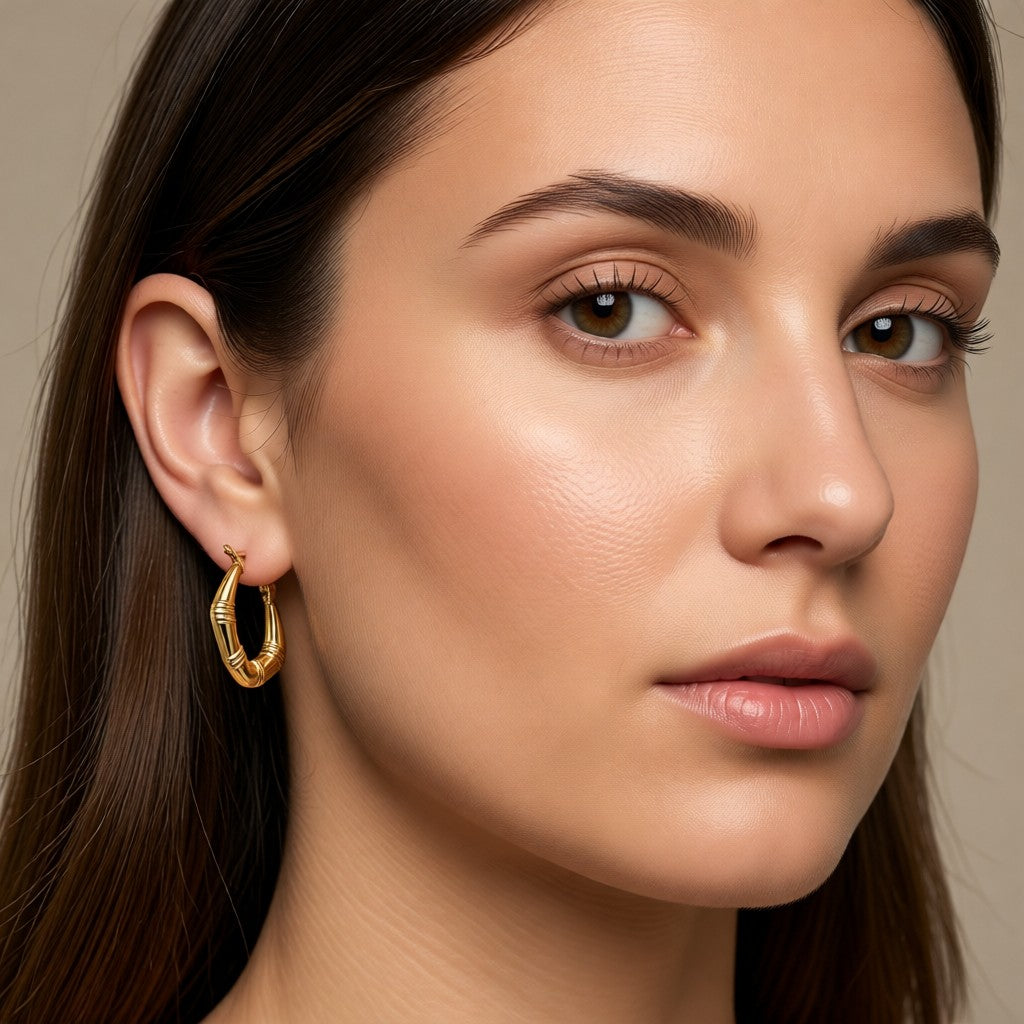 Aramat Jewels small gold hoop earrings with a subtle striped texture, 20mm diameter.
