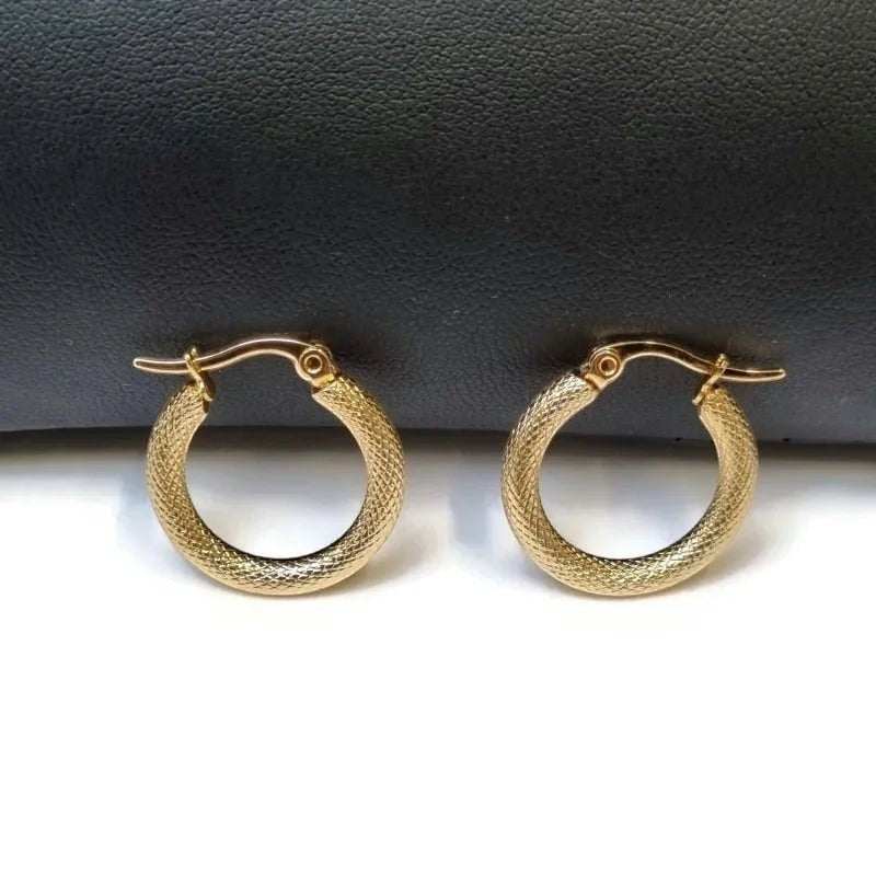 Aramat Jewels gold textured stainless steel hoop earrings, 22mm diameter, with a secure hinge clasp.