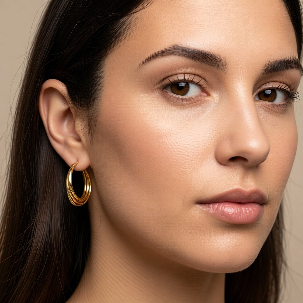 Aramat Jewels gold triple hoop earrings, 24x21x9mm, made of stainless steel with a smooth design.