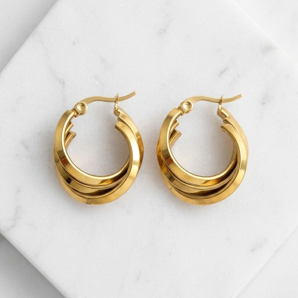 Aramat Jewels gold triple hoop earrings, 25x9mm, stainless steel with a hinge closure.