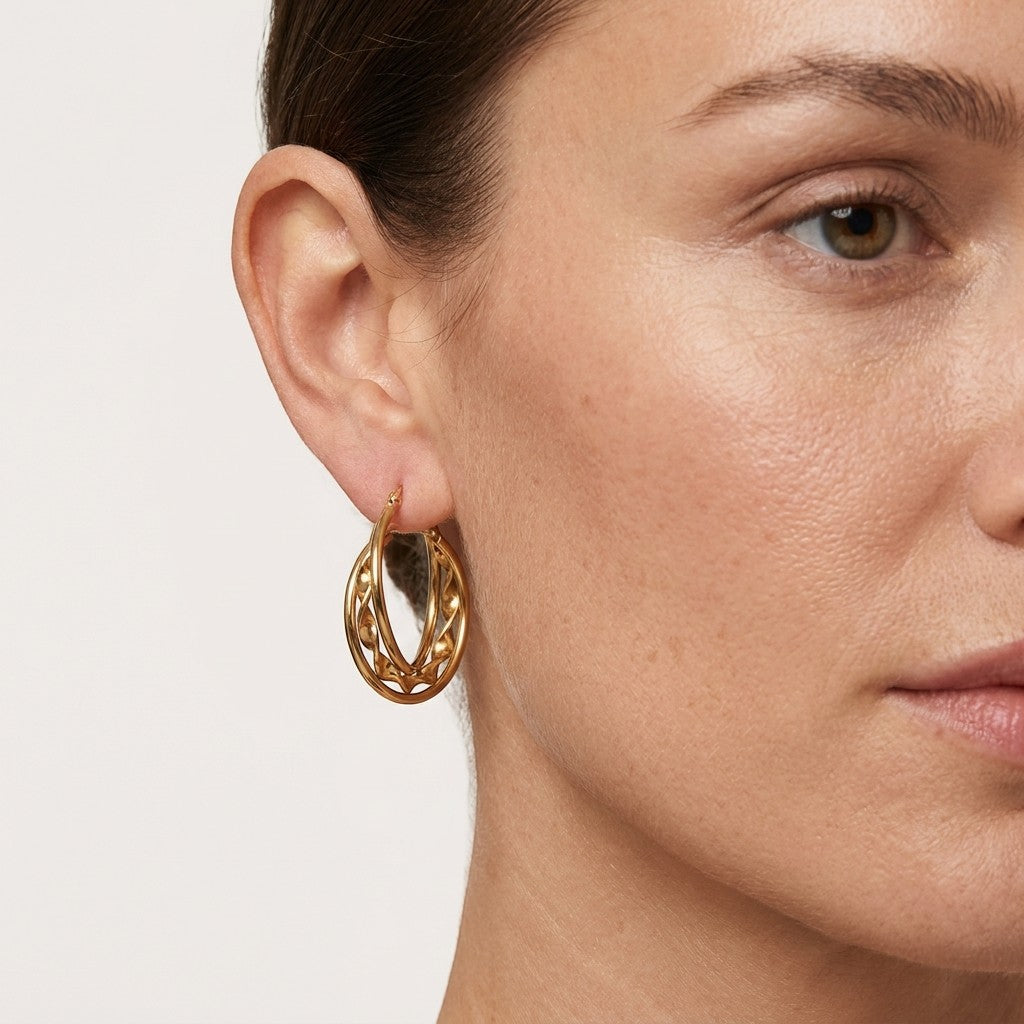 Aramat Jewels gold-tone stainless steel triple hoop earrings with a twisted detail and small beads.