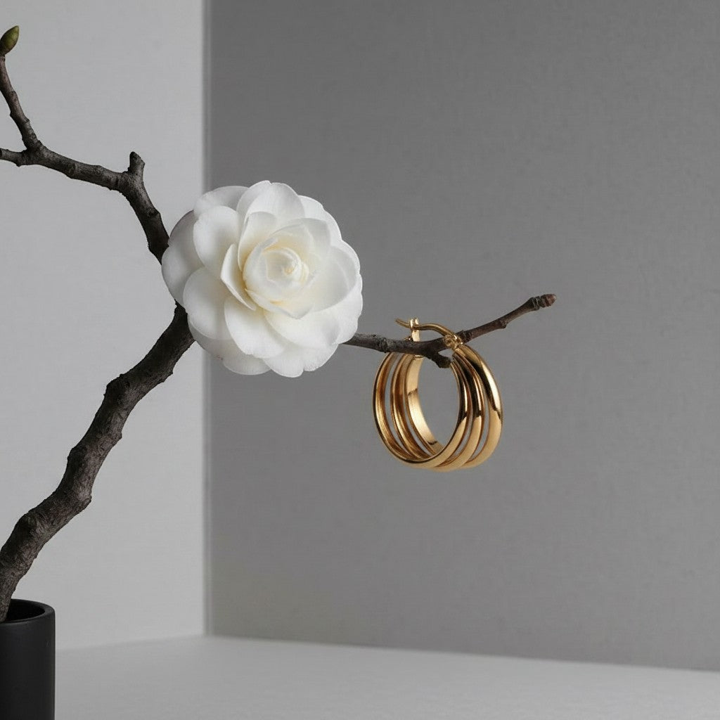 Aramat Jewels gold-tone stainless steel triple hoop earrings, 28mm, with a modern 3-in-1 design.