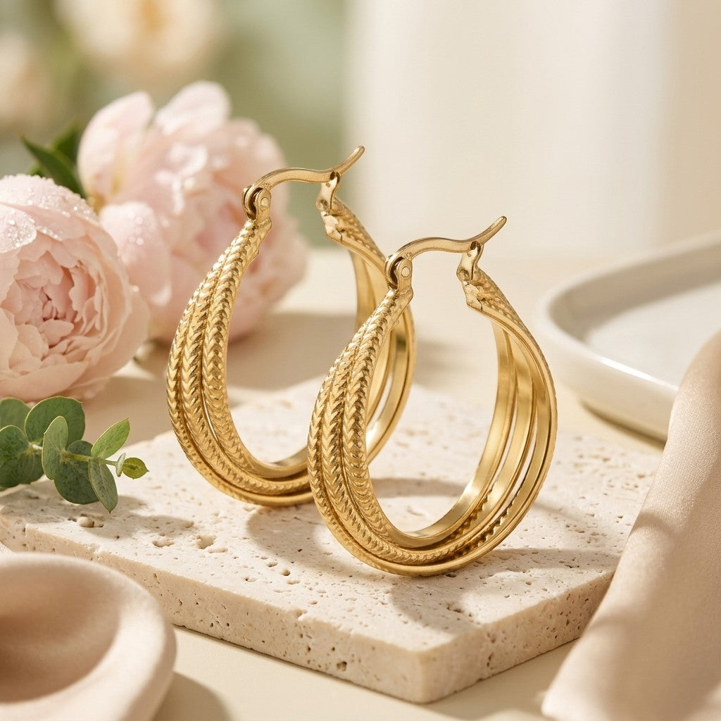 Aramat Jewels gold triple hoop earrings with a braided stripe pattern, 20x7.5mm, made of stainless steel.