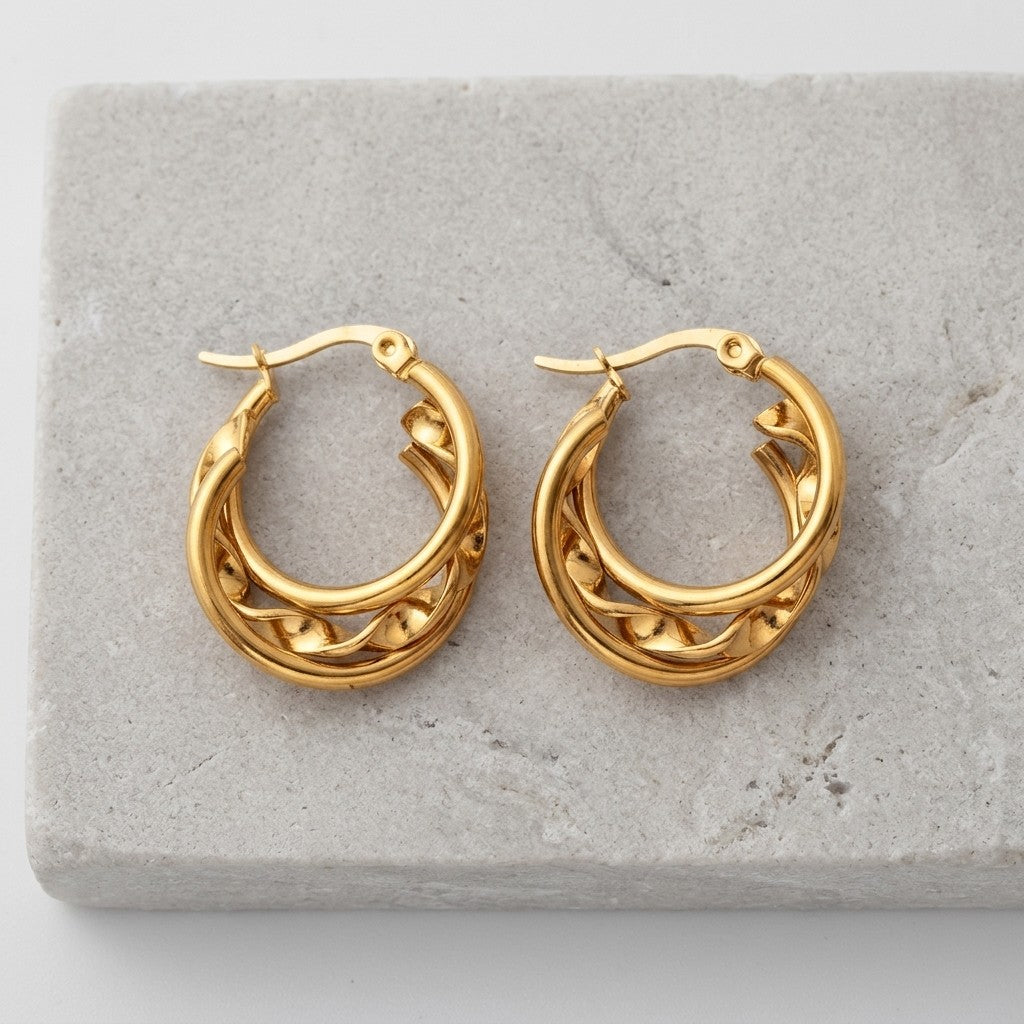 Aramat Jewels gold-tone stainless steel triple hoop earrings with twisted detail, 20x7mm.