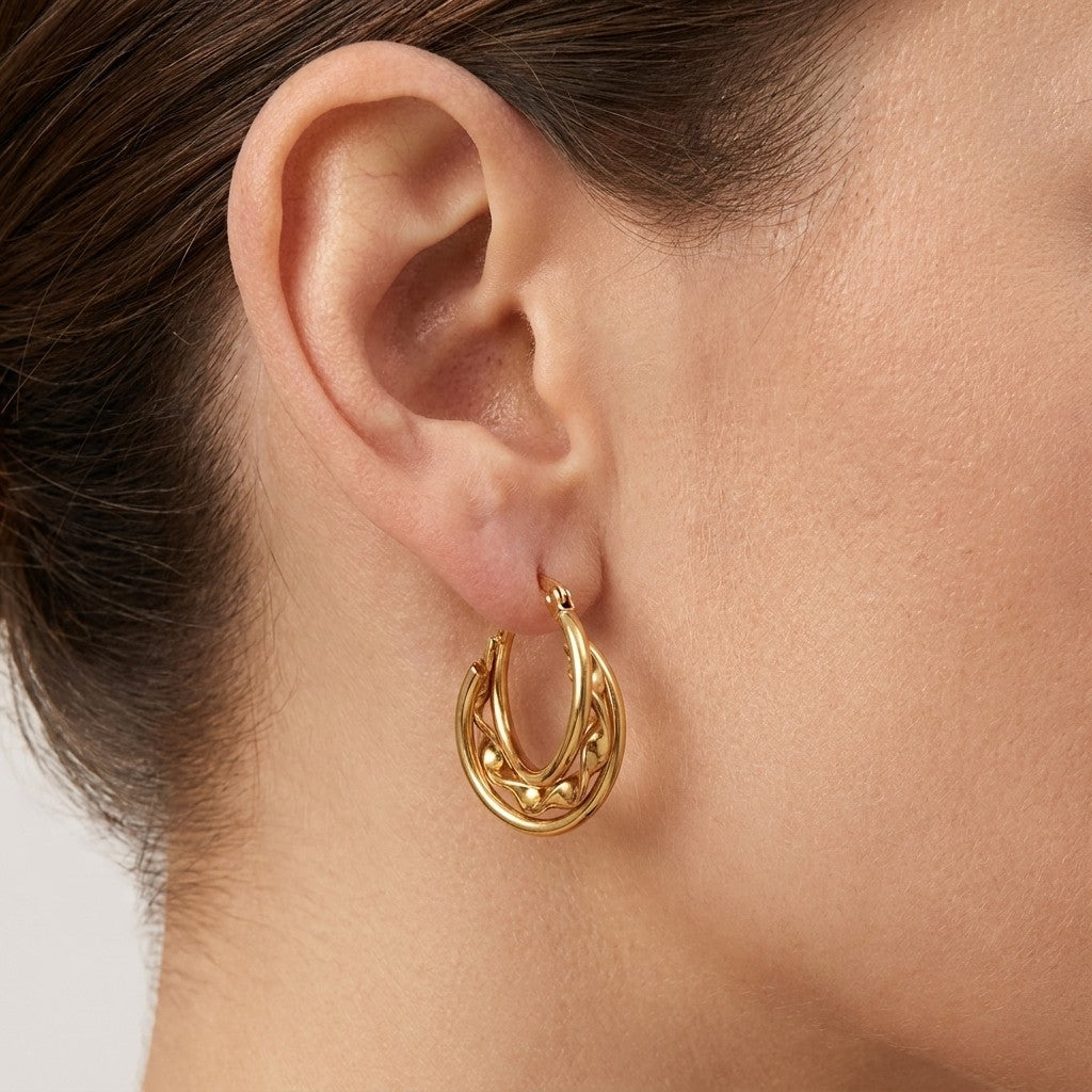 Aramat Jewels gold triple hoop earrings with twisted detail, 20x7mm, made of stainless steel.