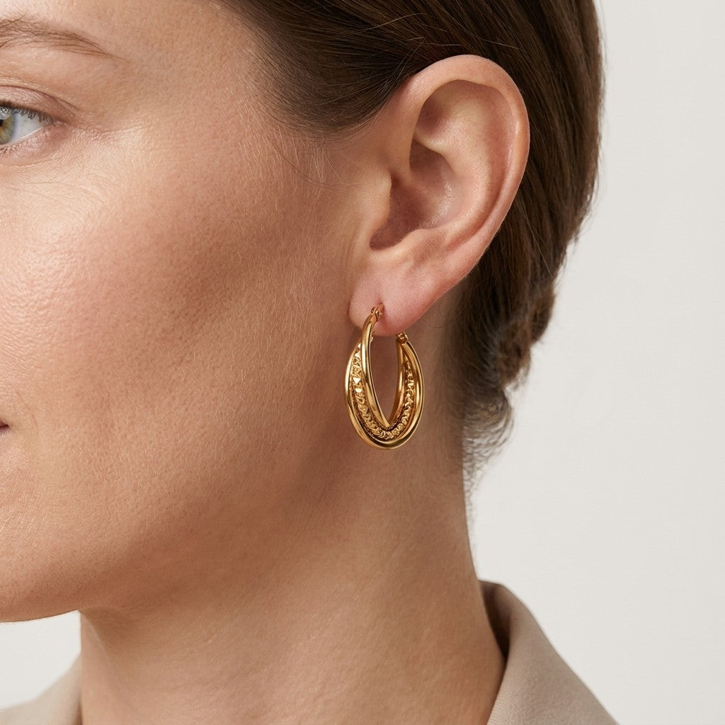 Aramat Jewels gold-tone triple hoop earrings with twisted design, 25mm diameter.