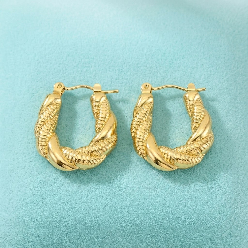 Aramat Jewels gold-tone twisted rectangular hoop earrings, 26x20mm, made of stainless steel.