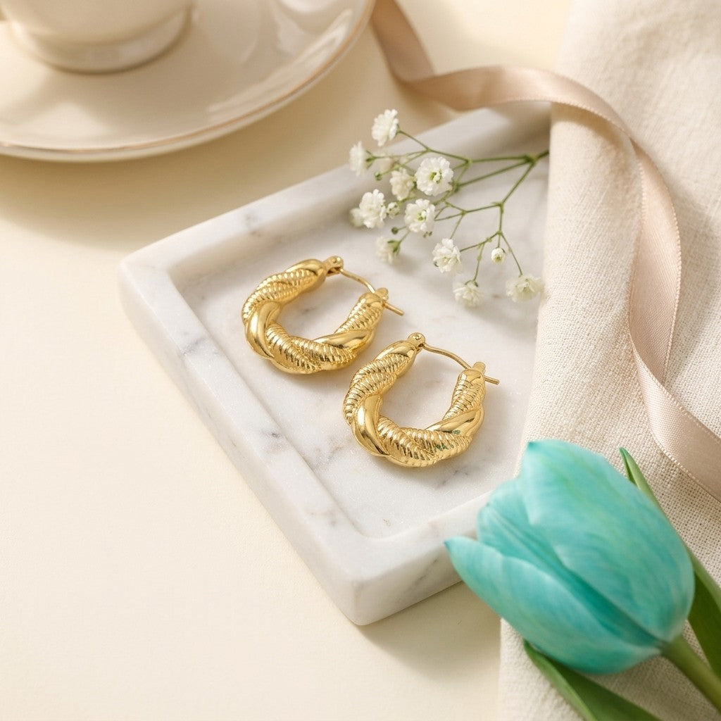 Aramat Jewels gold twisted rectangular hoop earrings, 26x20mm, made of stainless steel, perfect for an ear party.