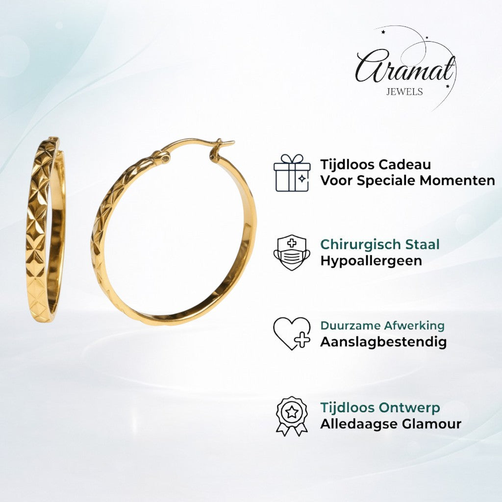 Aramat Jewels gold-tone stainless steel XXL hoop earrings with a diamond-cut pattern, 35mm diameter.