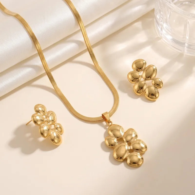 Aramat Jewels goudkleurige RVS sieradenset met slangenketting en oorbellen in de vorm van ovale halve bollen