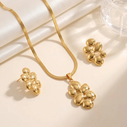 Aramat Jewels goudkleurige RVS sieradenset met slangenketting en oorbellen in de vorm van ovale halve bollen