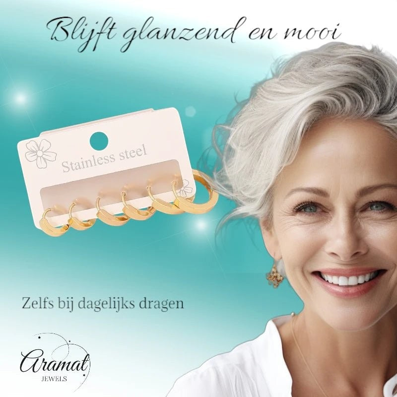Aramat Jewels goudkleurige stainless steel huggie oorringen set in drie maten met een lachende vrouw op de achtergrond