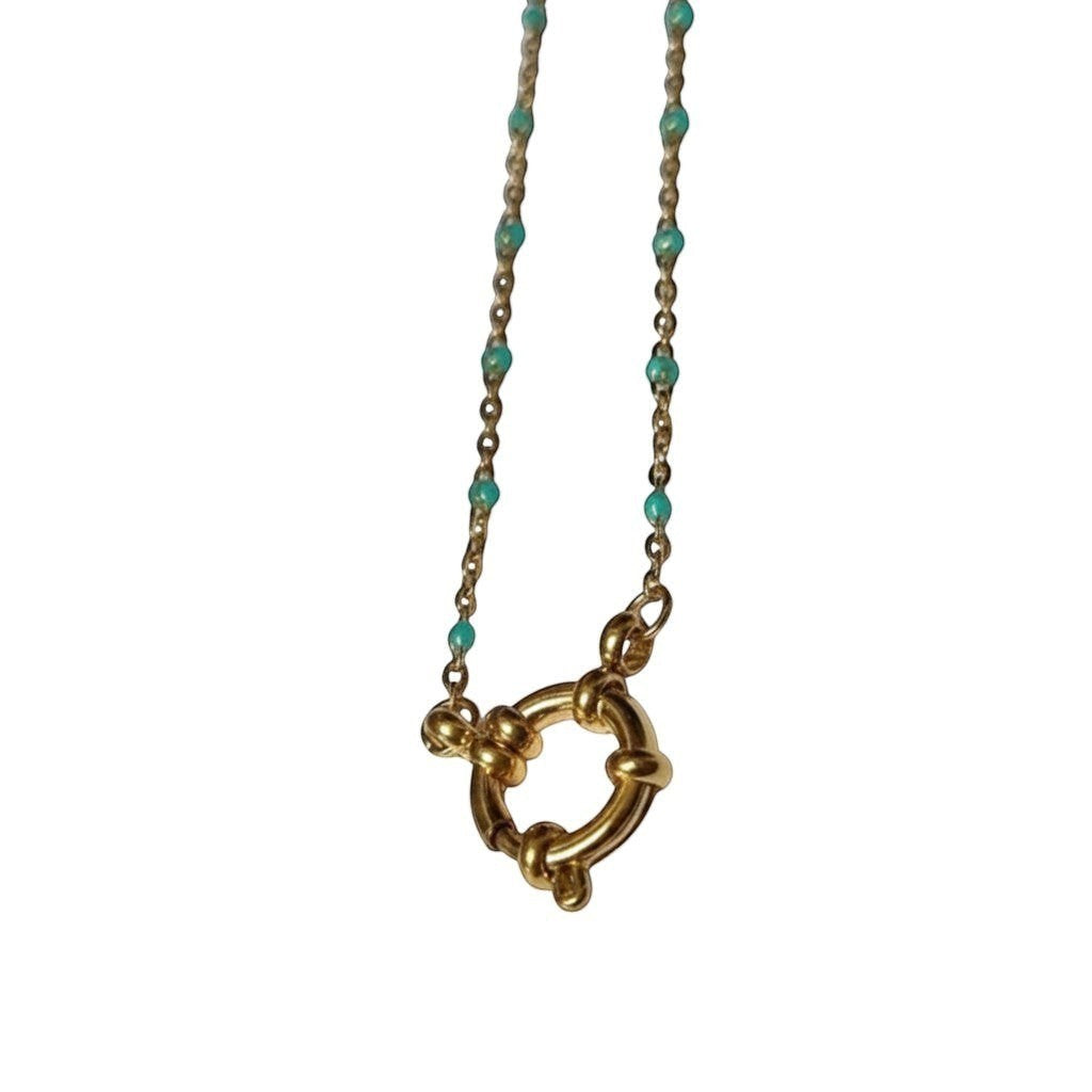Aramat Jewels gold-tone stainless steel necklace with small green enamel beads and a circular clasp.