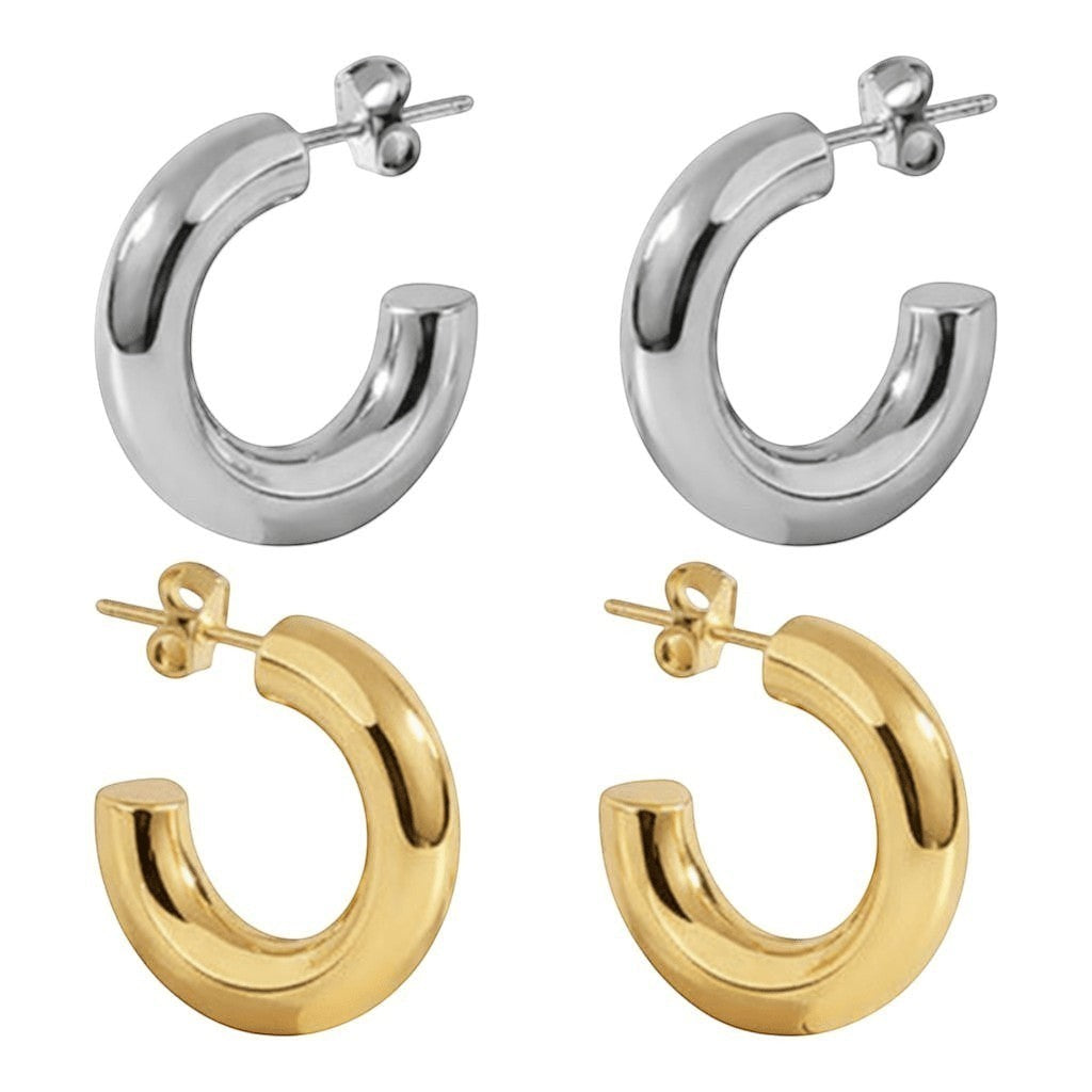 Aramat Jewels massieve halve oorringen in zilver en goudkleurig RVS, 25x8mm, glad en chunky design.