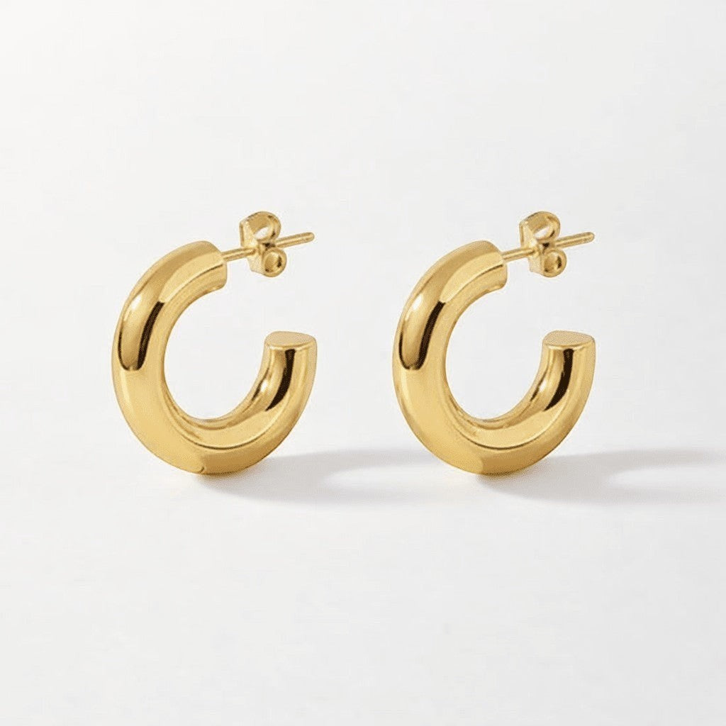 Aramat Jewels massieve gouden halve oorringen van RVS, 25x8mm, gladde chunky hoepels.