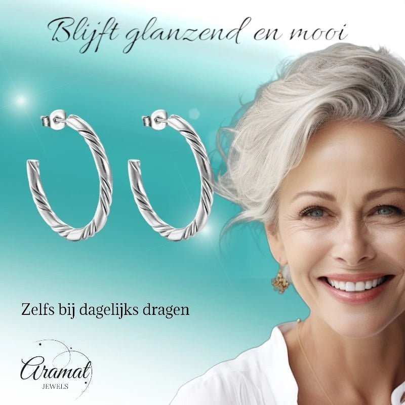 Aramat Jewels zilverkleurige halve twisted hoepel oorbellen van RVS met een elegant gedraaid design van 30mm.