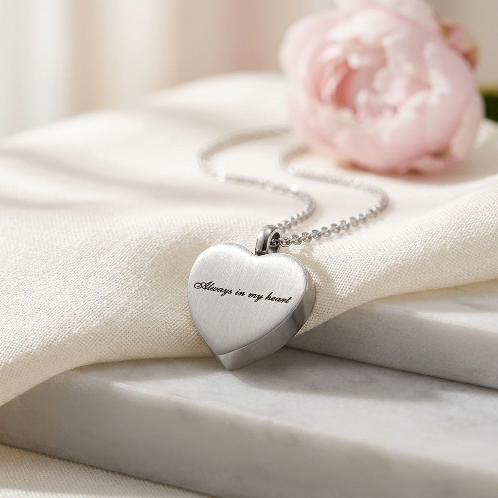 Aramat Jewels silver-tone stainless steel heart-shaped cremation necklace with "Always in my heart" engraving, 2.5x2cm, with a 50cm chain.