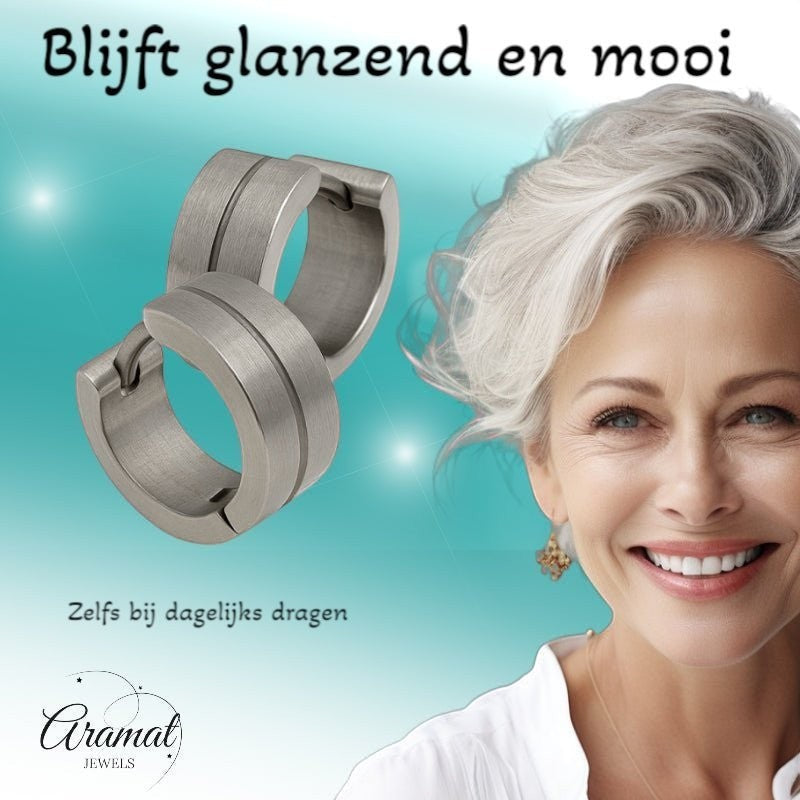 Aramat Jewels matte silver stainless steel huggie earrings with a subtle glossy stripe detail, 13mm.