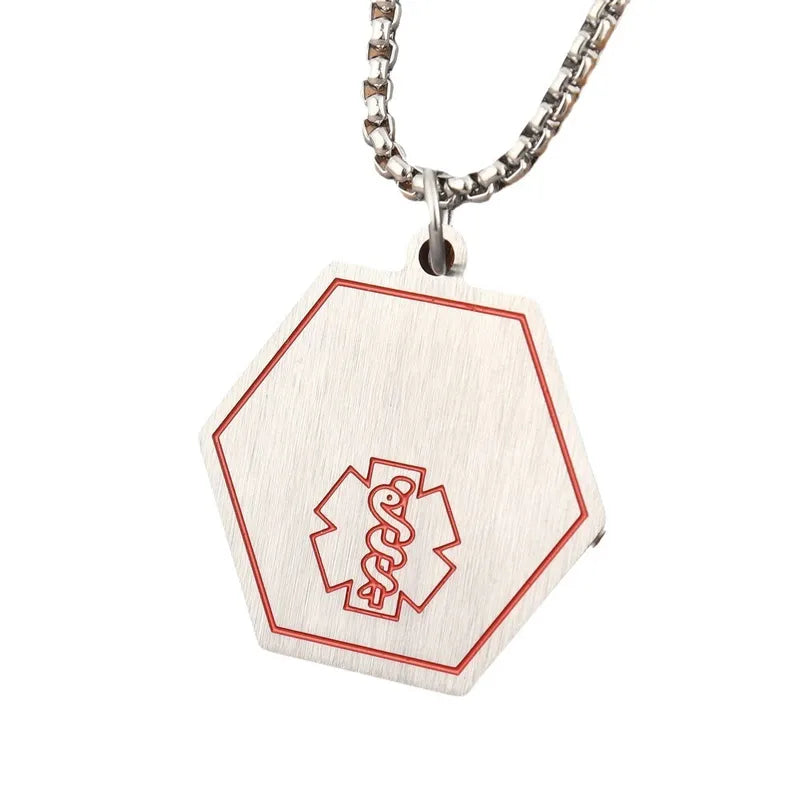 Aramat Jewels zeshoekige medische hanger van roestvrij staal met rode Staf van Aesculapius en bijpassende ketting.