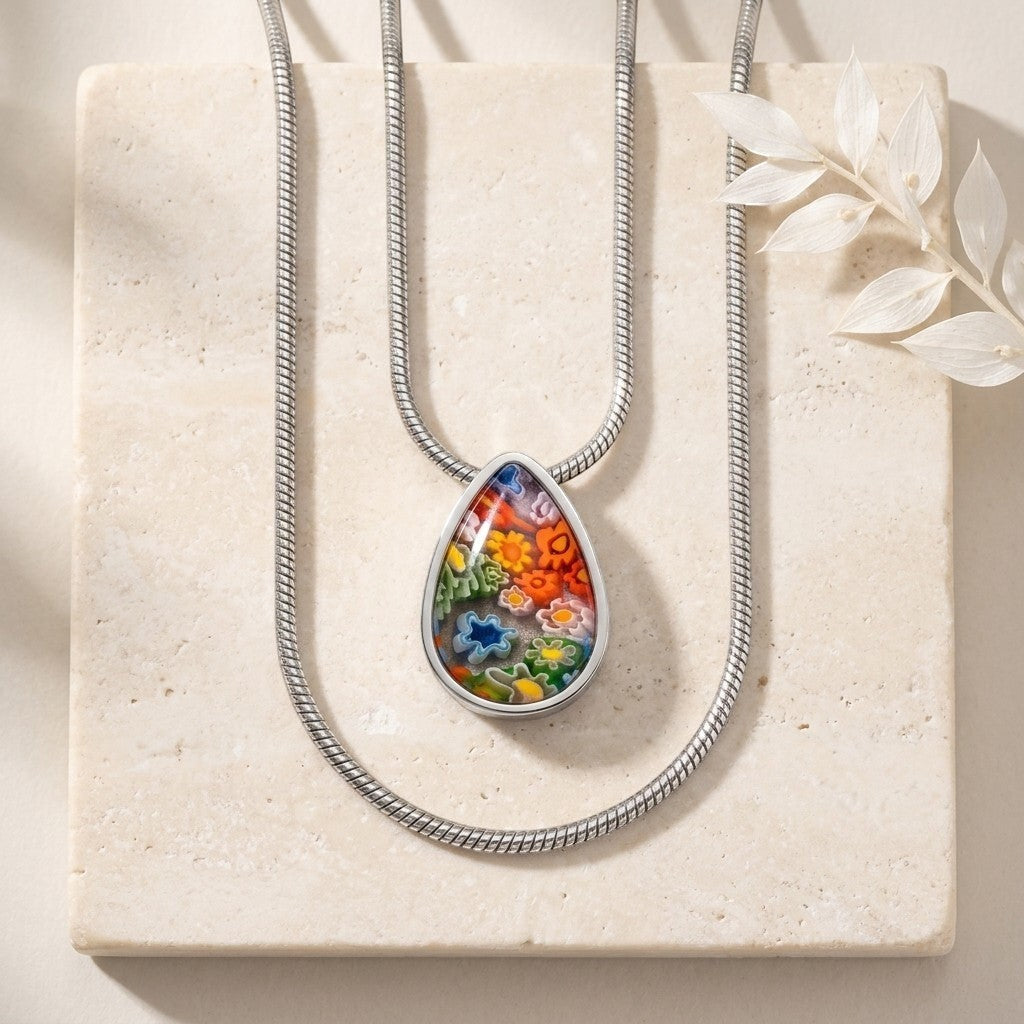 Aramat Jewels teardrop pendant with colorful Murano glass floral pattern, 2cm, 316L stainless steel.