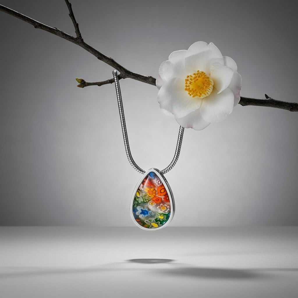 Aramat Jewels teardrop pendant with colorful Murano glass floral inlay, made of 316L stainless steel.