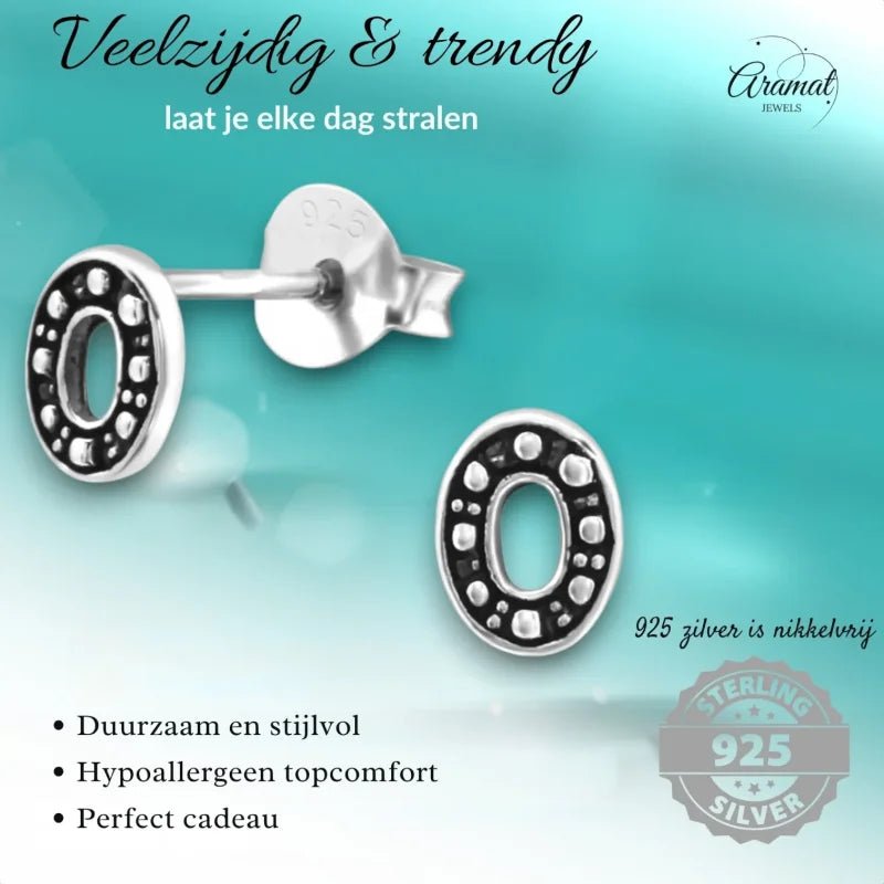 Aramat Jewels 925 sterling silver oval stud earrings with a dark Bali-style beaded pattern and open center design.