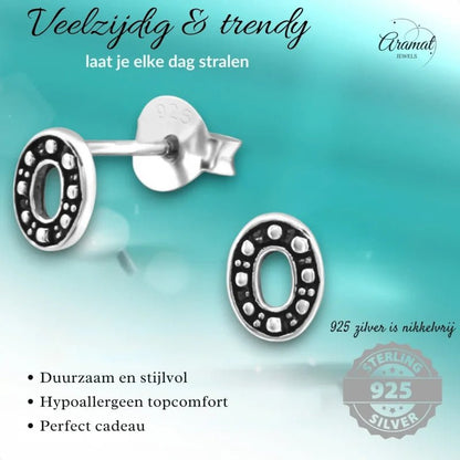 Aramat Jewels 925 sterling silver oval stud earrings with a dark Bali-style beaded pattern and open center design.