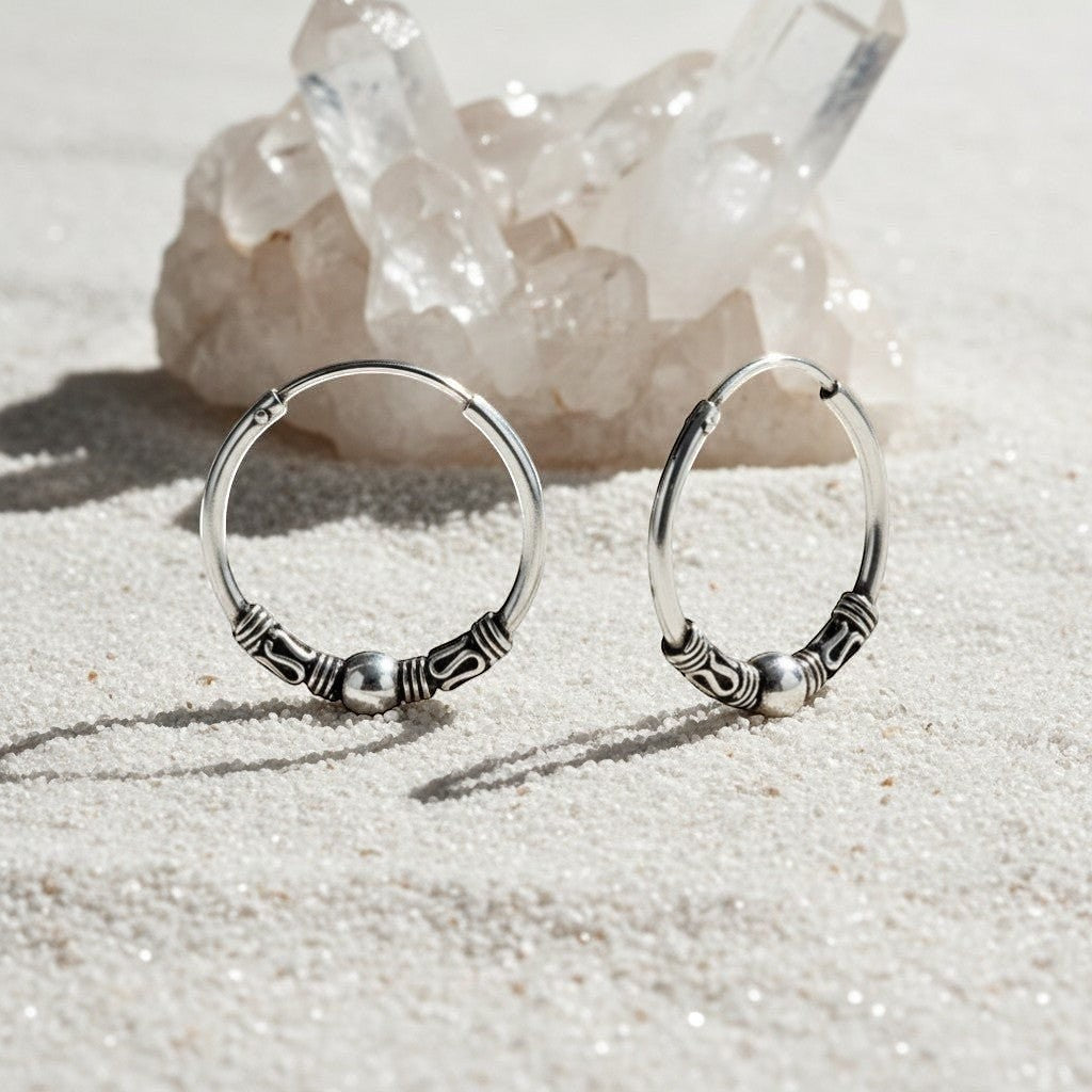 Aramat Jewels 18mm oxidised silver Bali hoop earrings with intricate ethnic detailing and a central bead.